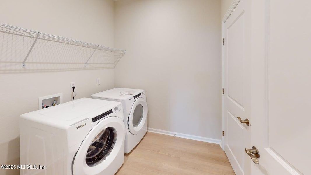 Furnished interior view inside a new home in RiverTown - WaterSong, St. Johns (Image 6).