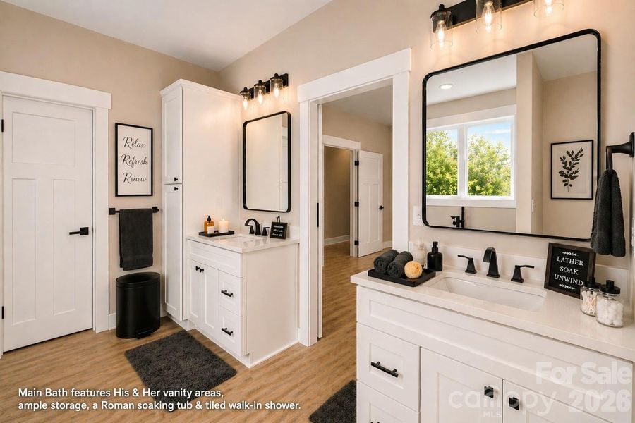 Luxury main Bath with his & her separate vanities & storage.