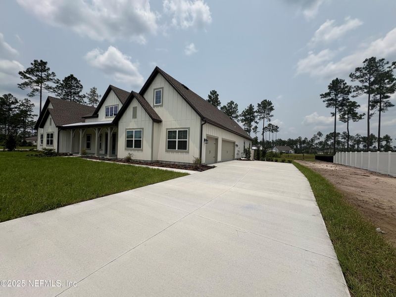 Front exterior of a new home in , Hilliard, FL, highlighting curb appeal (Image 20).
