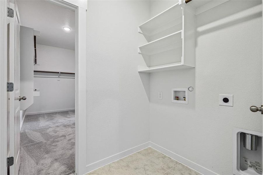 Laundry room featuring washer hookup, electric dryer hookup, hookup for a gas dryer, and light carpet