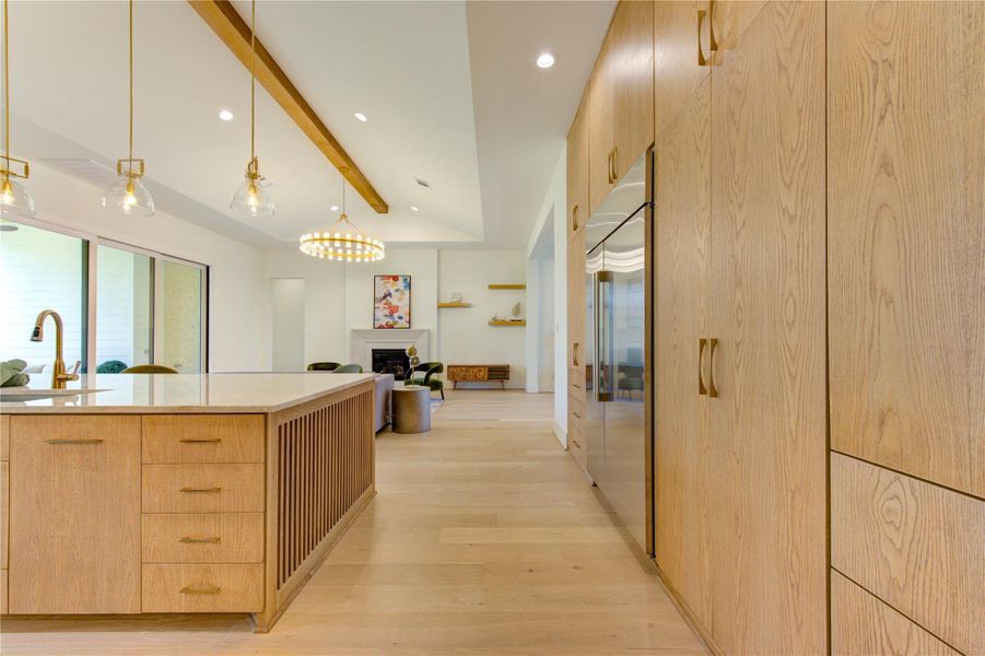 Custom cabinetry and integrated storage solutions provide exceptional organization while maintaining clean architectural lines.