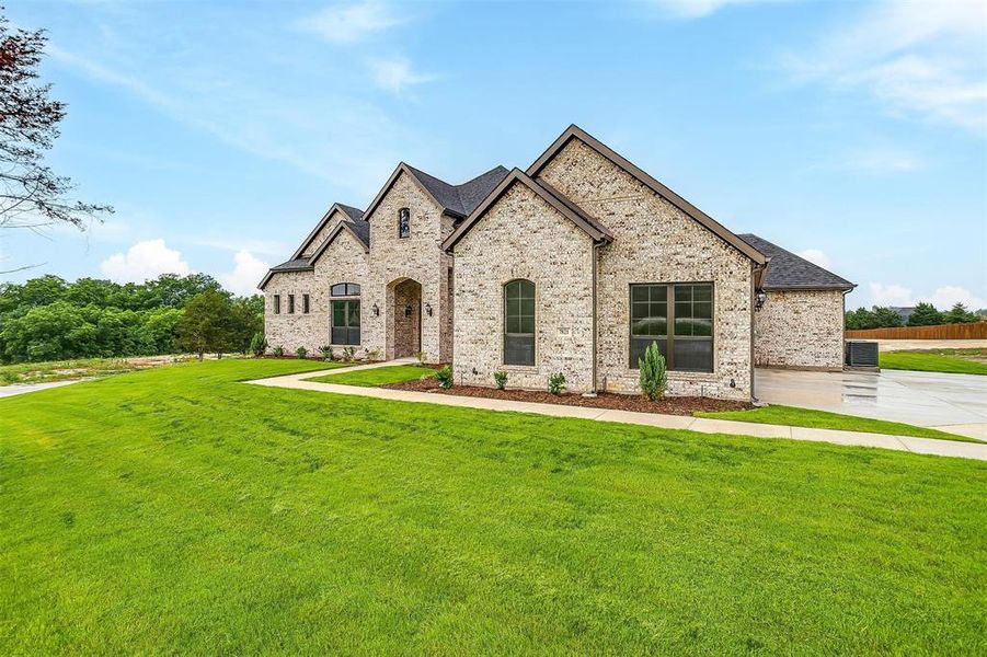 French country style house with a front lawn