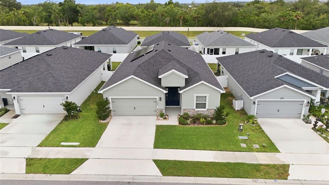 Front exterior of a new home in Geneva Landings, Davenport, FL, highlighting curb appeal (Image 2).