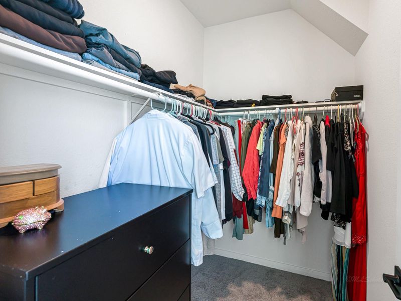 Walk-in primary closet Walk-in primary closet