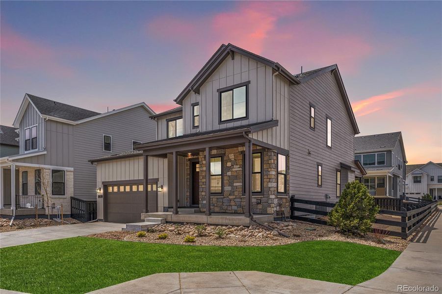 Front exterior of a new home in Stargaze at Solstice, Littleton, CO, highlighting curb appeal (Image 2). Front exterior of a new home in Stargaze at Solstice, Littleton, CO, highlighting curb appeal (Image 2).