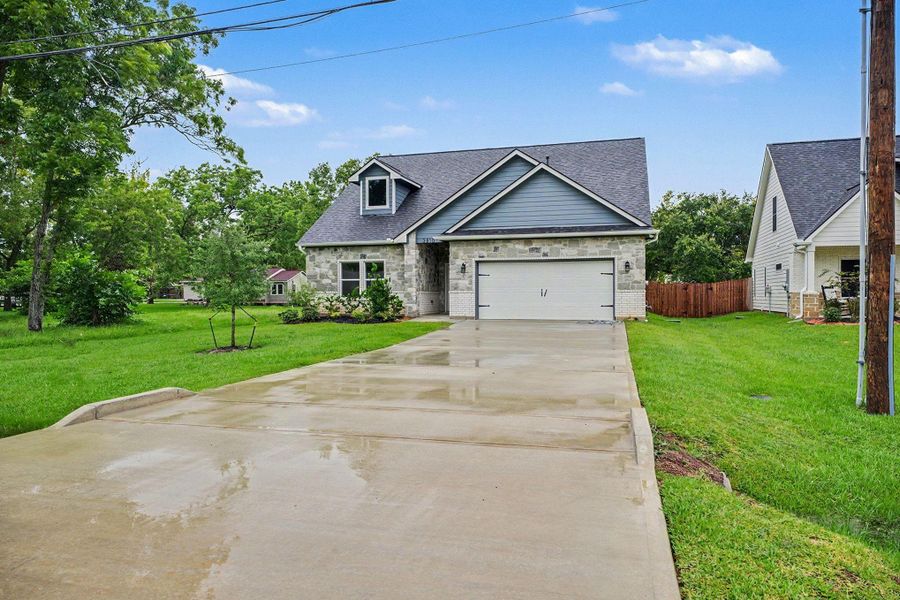 Front exterior of a new home in , Santa Fe, TX, highlighting curb appeal (Image 23). Front exterior of a new home in , Santa Fe, TX, highlighting curb appeal (Image 23).