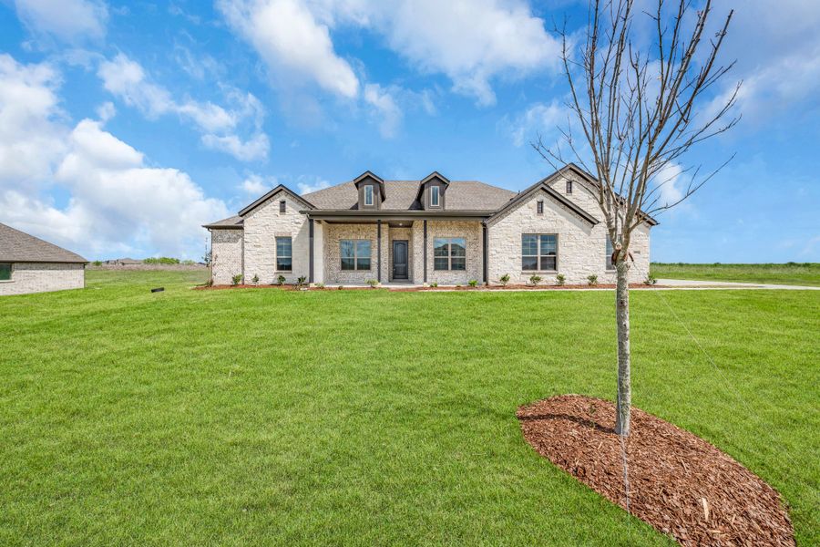 Front exterior of a new home in Berkshire Estates, Mesquite, TX, highlighting curb appeal (Image 26). Front exterior of a new home in Berkshire Estates, Mesquite, TX, highlighting curb appeal (Image 26).
