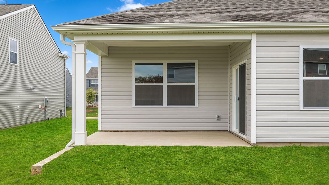 Exterior details and patio area of a home in Durbin Meadows Traditions, Fountain Inn (Image 2).