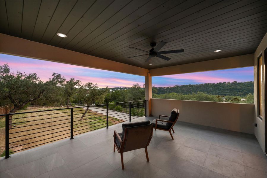 Upstairs covered terrace with hill country views. Upstairs covered terrace with hill country views.