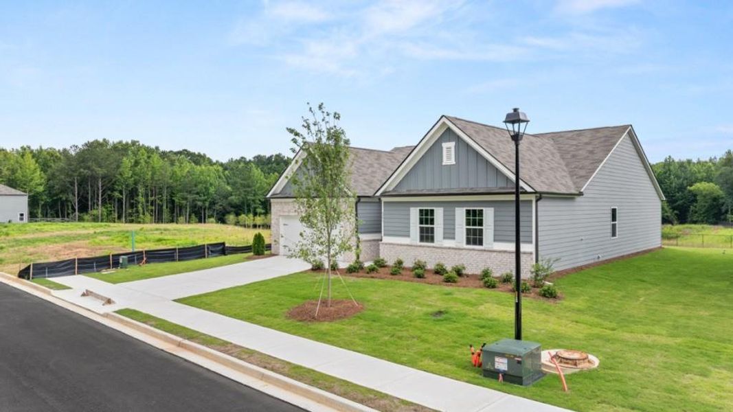 Front exterior of a new home in , South Fulton, GA, highlighting curb appeal (Image 1). Front exterior of a new home in , South Fulton, GA, highlighting curb appeal (Image 1).
