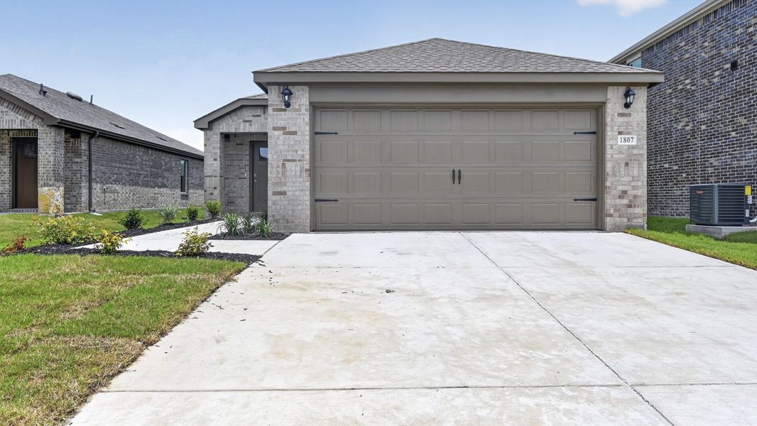 Front exterior of a new home in Creekside Ranch, Blue Ridge, TX, highlighting curb appeal (Image 2). Front exterior of a new home in Creekside Ranch, Blue Ridge, TX, highlighting curb appeal (Image 2).