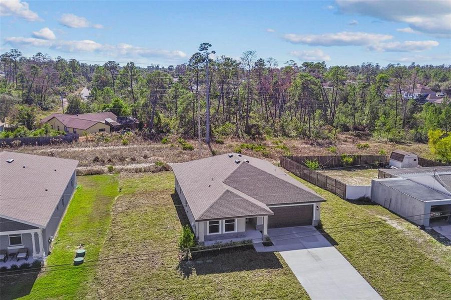Front exterior of a new home in , Spring Hill, FL, highlighting curb appeal (Image 32).