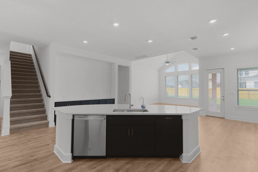 Representative furnished interior of a home built from the Madison by Chesmar Homes in Newhaven, Manor (Image 6).