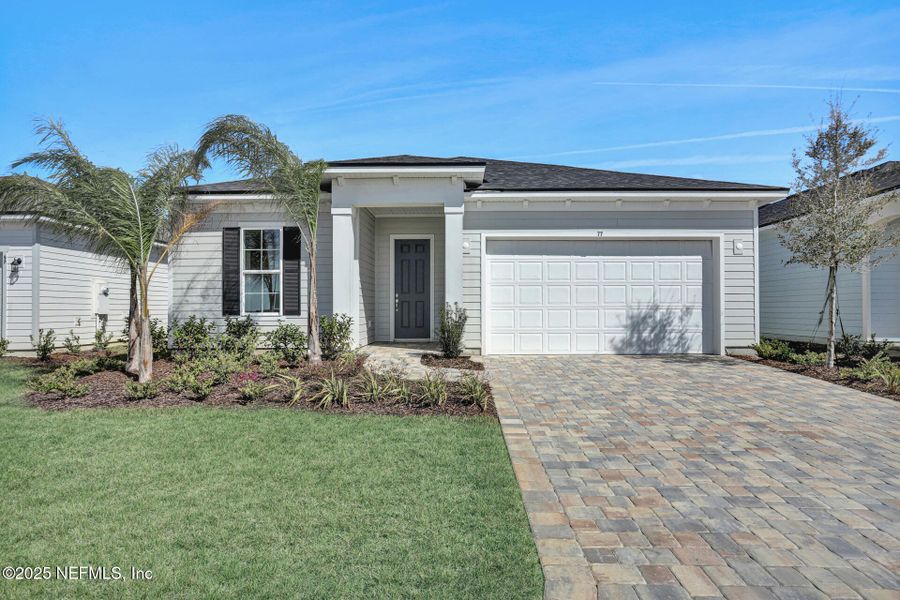 Front exterior of a new home in Reverie at Silverleaf, St. Augustine, FL, highlighting curb appeal (Image 14).