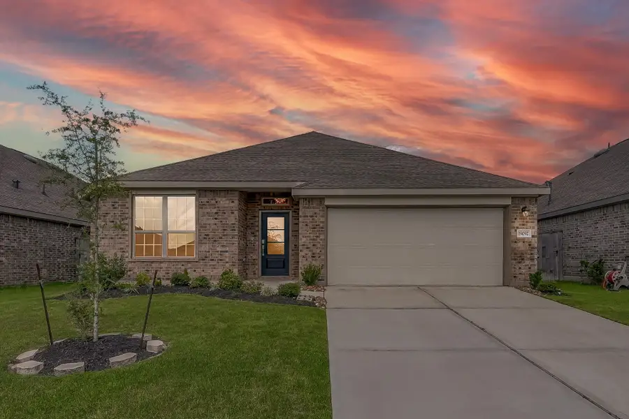 Front exterior of a new home in Tavola: Wildflower II Collection, New Caney, TX, highlighting curb appeal (Image 1).
