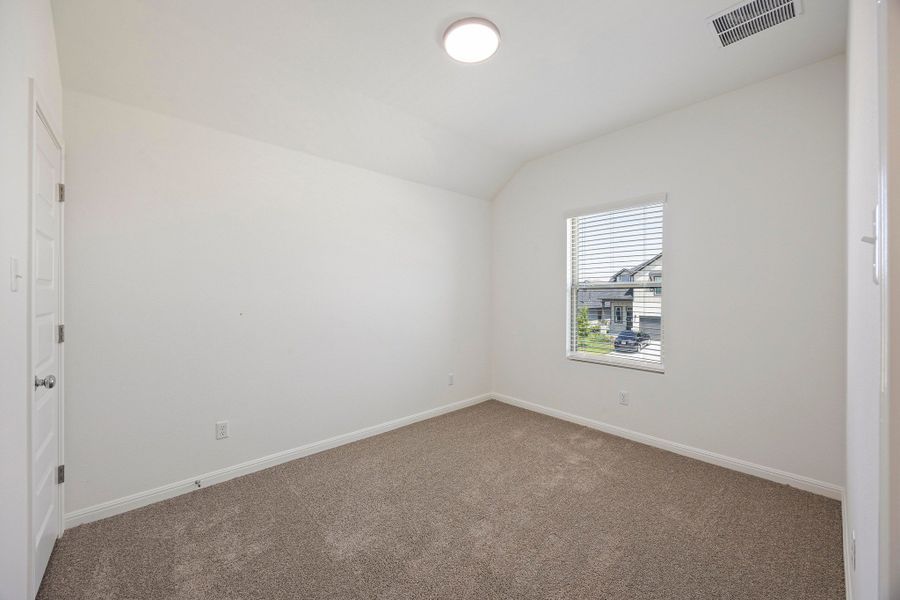 Bedroom in the Magnolia home plan by Trophy Signature Homes – REPRESENTATIVE PHOTO