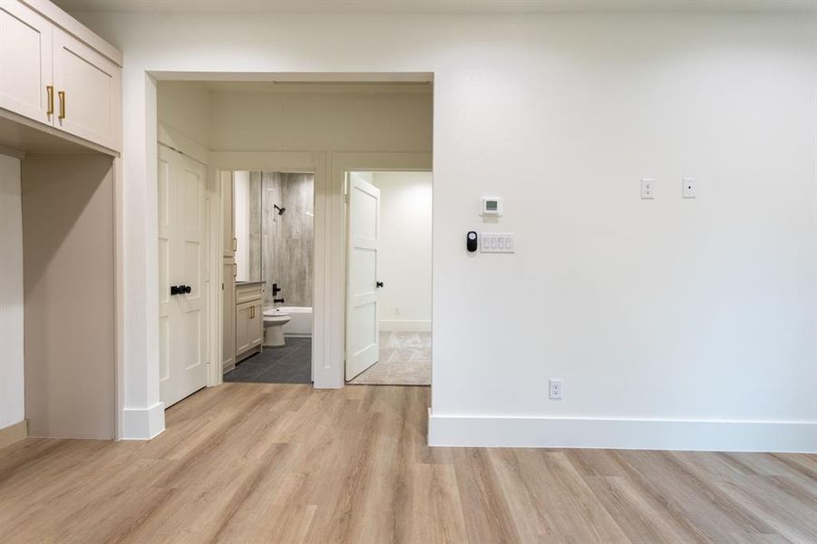 Hall featuring light hardwood / wood-style flooring