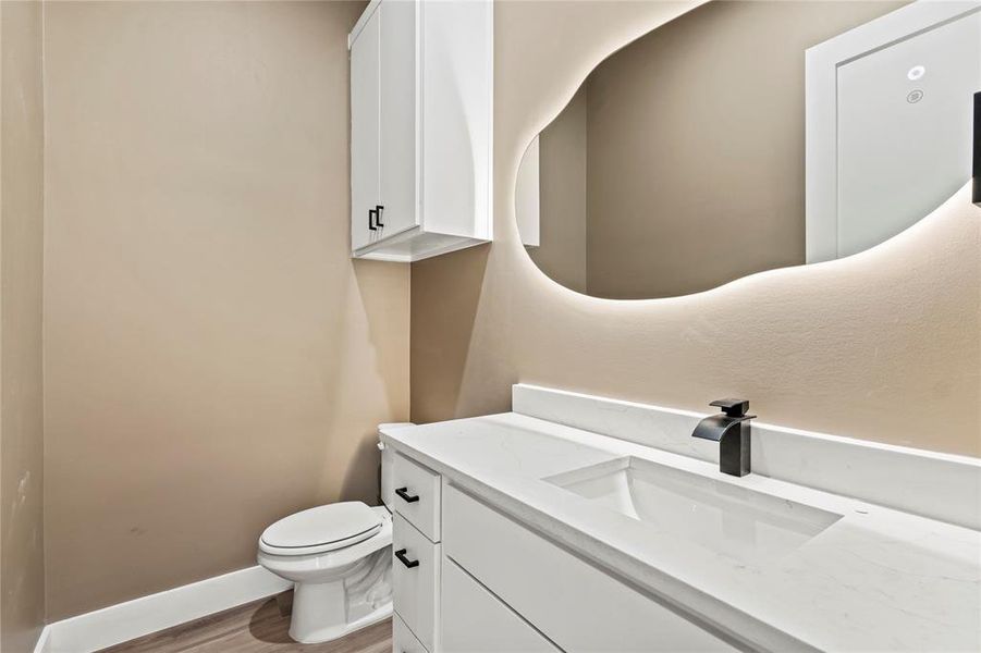 Bathroom with vanity and light wood-style floors