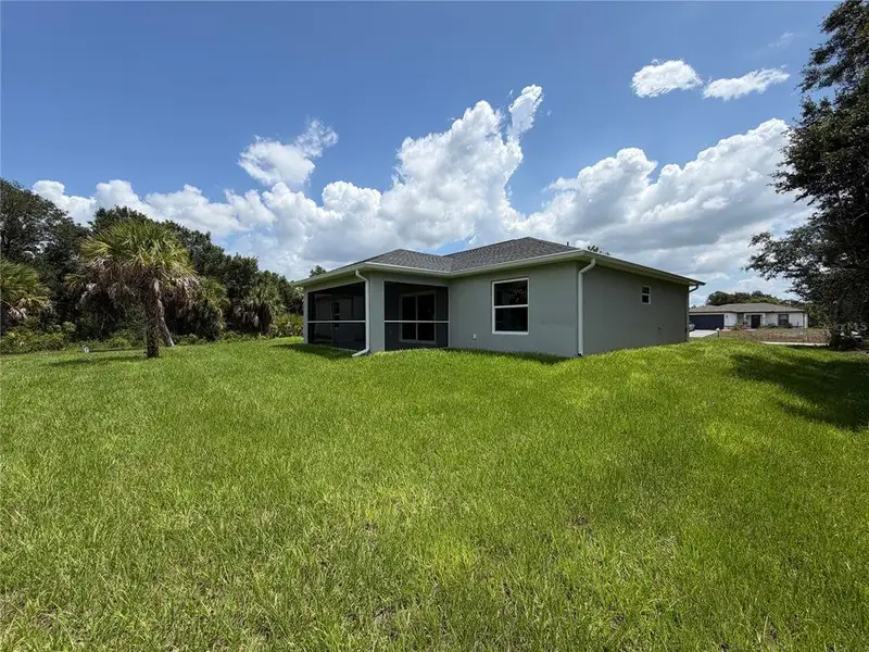 Exterior details and patio area of a home in , North Port (Image 23).