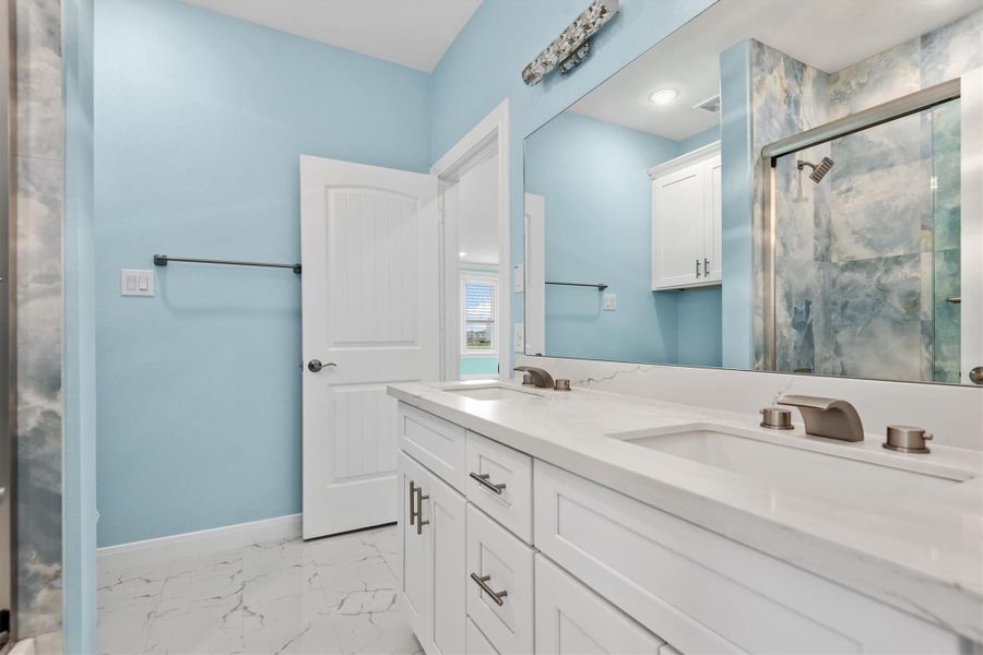 Guest suite with dual sinks as this is primary guest bathroom for 1st floor.