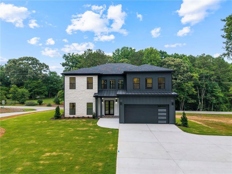 Front exterior of a new home in , Gainesville, GA, highlighting curb appeal (Image 1). Front exterior of a new home in , Gainesville, GA, highlighting curb appeal (Image 1).