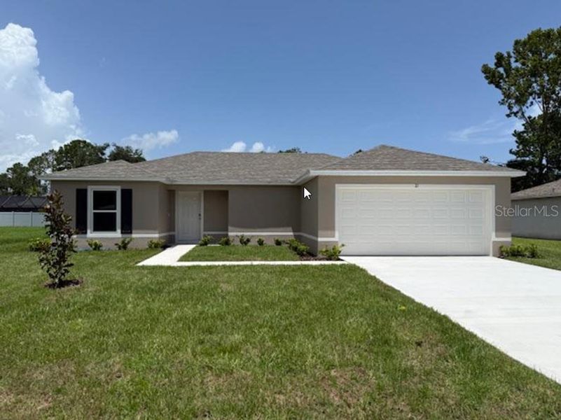 Front exterior of a new home in Palm Coast: Value Collection, Palm Coast, FL, highlighting curb appeal (Image 1).