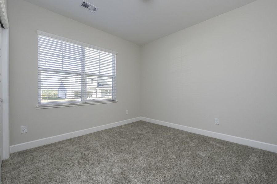 Representative unfurnished interior of a home built from the The Hunter by Cothran Homes in Holly Ridge, Greenville (Image 16).