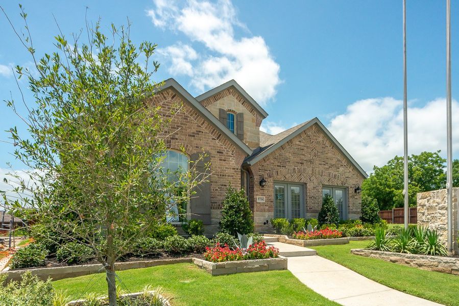 Front exterior of a new home in Wildridge, Oak Point, TX, highlighting curb appeal (Image 2).