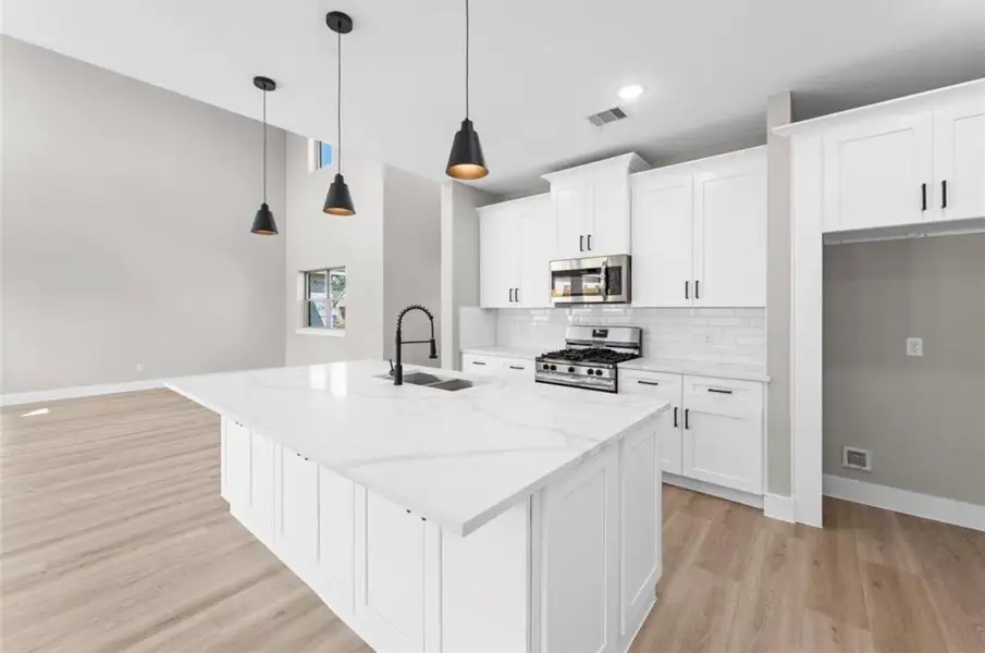 Furnished interior view inside a new home in , Spring (Image 8). Furnished interior view inside a new home in , Spring (Image 8).