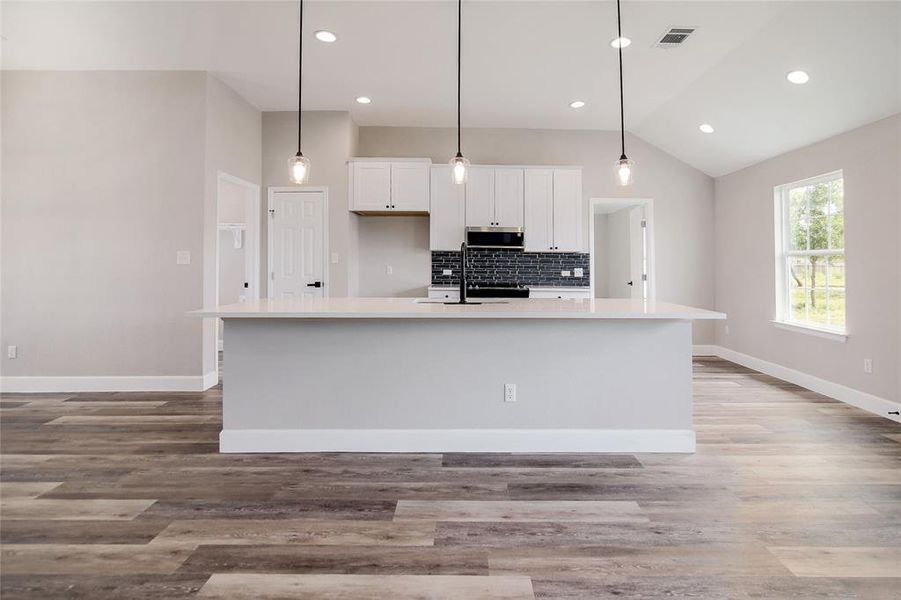 Everyone will want to gather around the inviting breakfast bar seating (with space for at least 4) on the large center island.