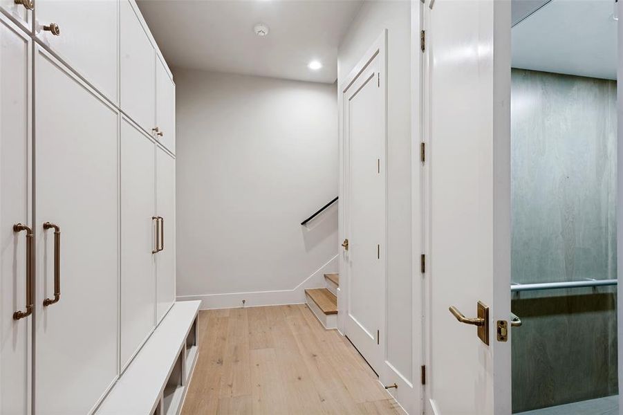 Lower Level offers a mud room with lockers just off the oversized 3 car garage with room for a golf cart. This home also offers an elevator.