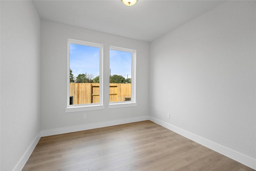 The Study offers a quiet workspace with wood flooring, high ceilings, double doors for added privacy, large windows, and custom paint for a polished finish.