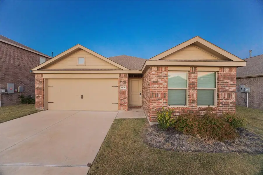 Front exterior of a new home in Mobberly Farms: Watermill Collection, Pilot Point, TX, highlighting curb appeal (Image 22).