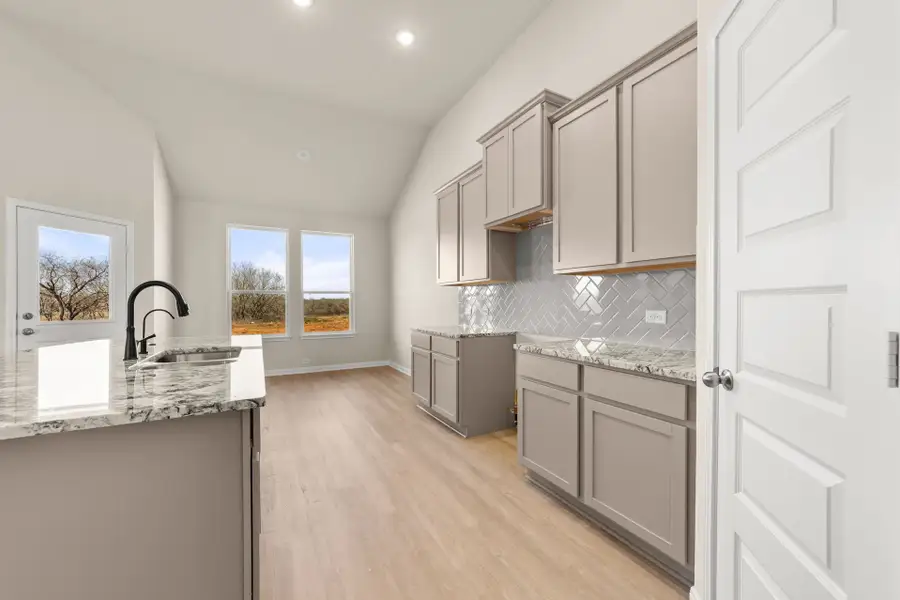 Furnished interior view inside a new home in Villas Las Flores, Floresville (Image 12).