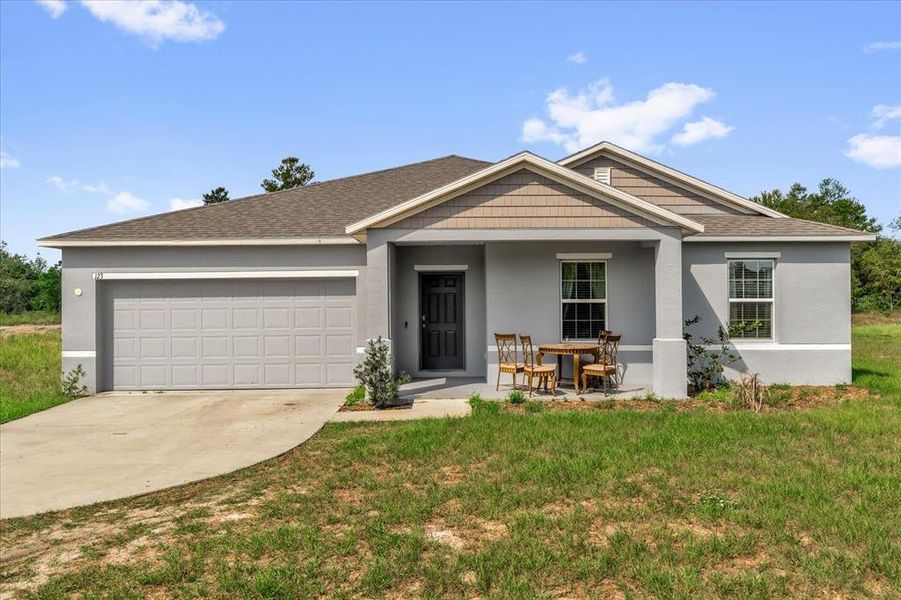 Front exterior of a new home in Poinciana, Poinciana, FL, highlighting curb appeal (Image 19).