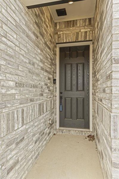 Covered front porch & look at the 8' front door!