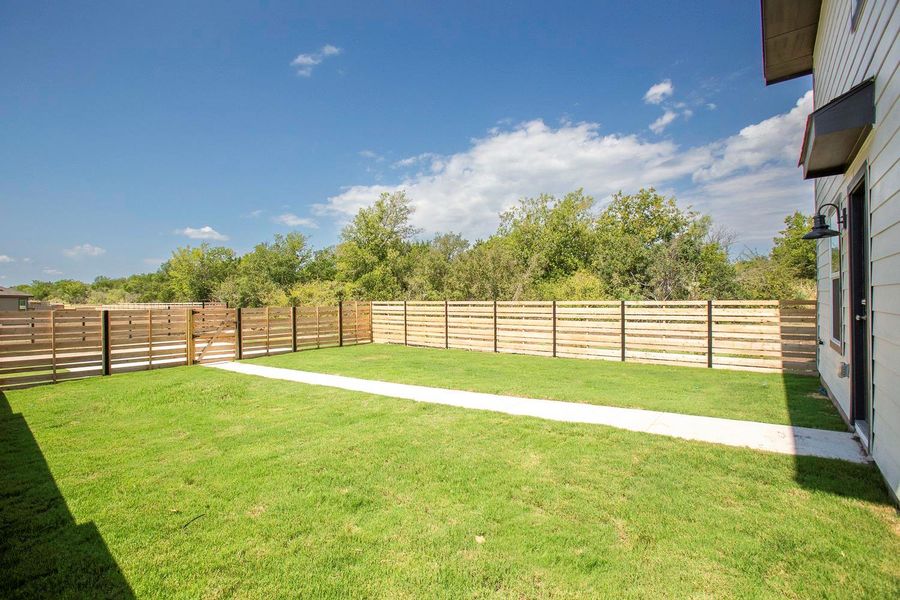 Exterior details and patio area of a home in Plum Creek North: Stonehill Collection, Kyle (Image 17).
