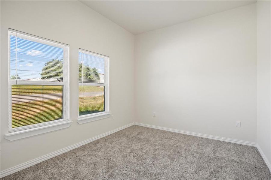 View of carpeted spare room