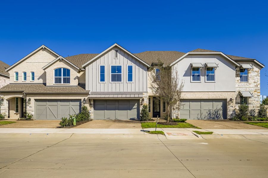 Front exterior of a new home in Castle Hills Northpointe - Townhomes, Carrollton, TX, highlighting curb appeal (Image 2). Front exterior of a new home in Castle Hills Northpointe - Townhomes, Carrollton, TX, highlighting curb appeal (Image 2).