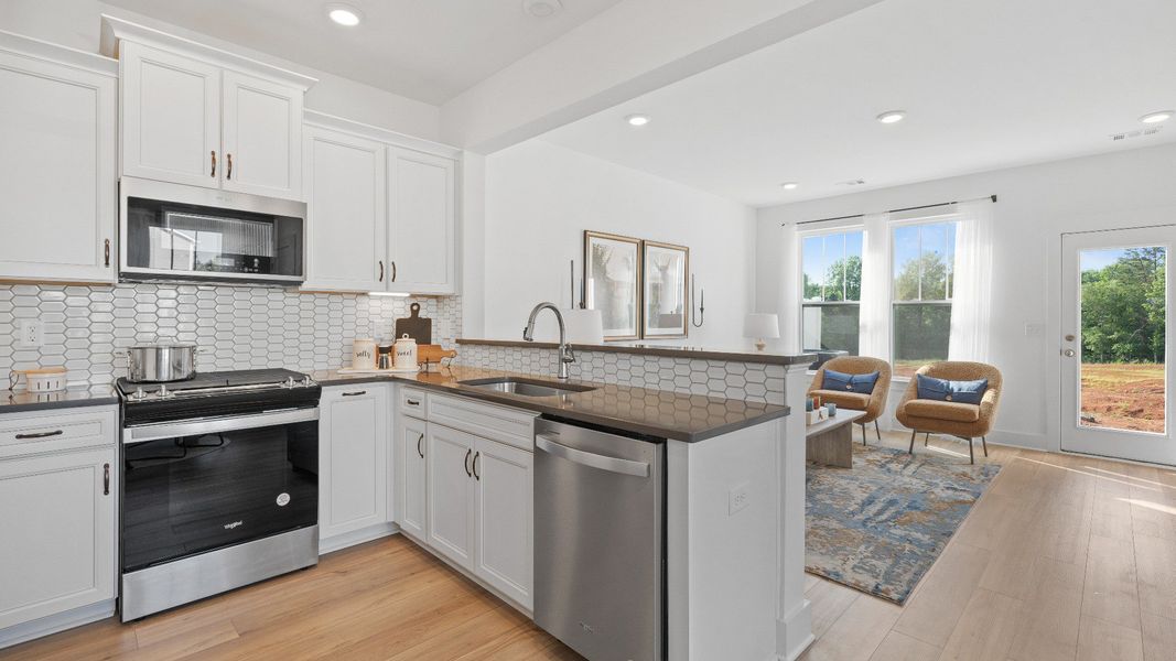 Refined kitchen layout of The Churchill Design offering both entertaining space and everyday functionality