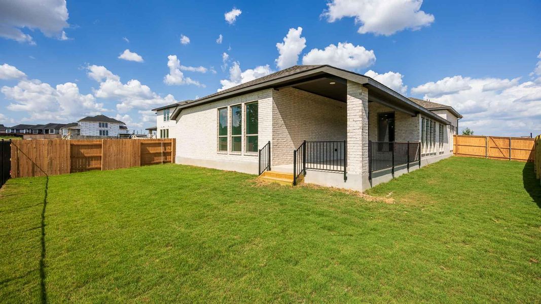 Exterior details and patio area of a home in The Colony, Bastrop (Image 3).