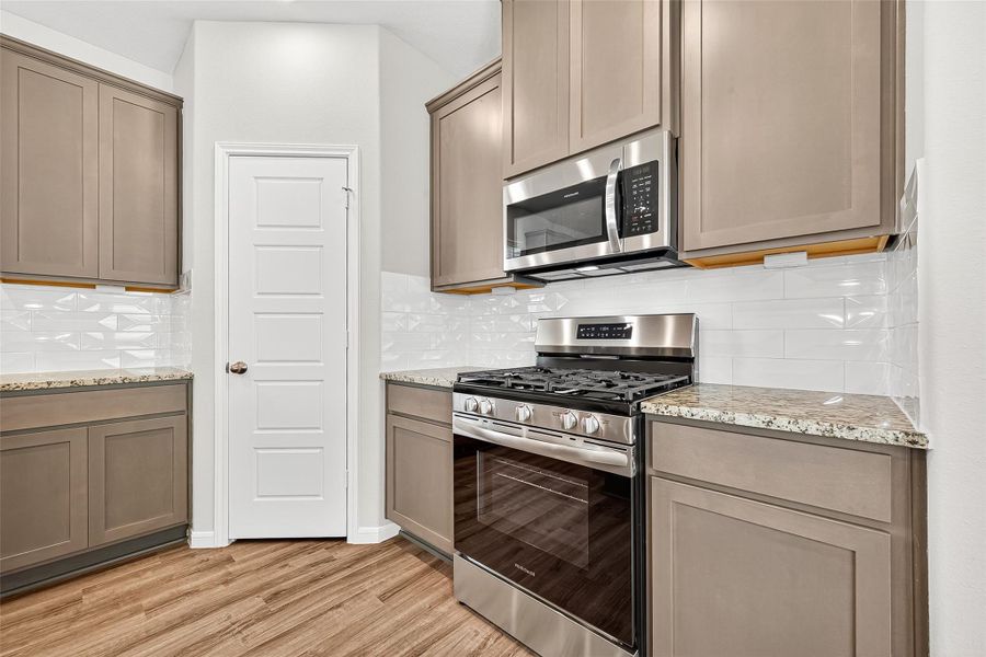 Furnished interior view inside a new home in Sunterra, Katy (Image 12).