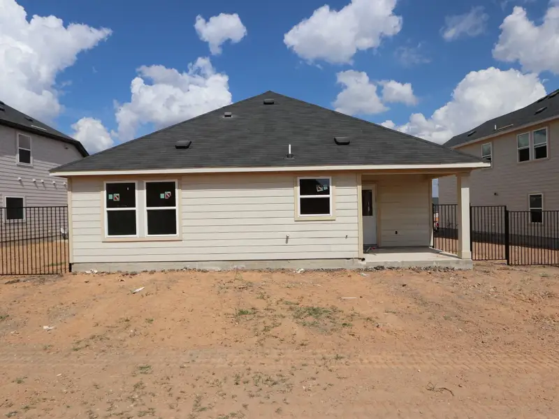 Exterior details and patio area of a home in Cascades at Onion Creek, Austin (Image 10).