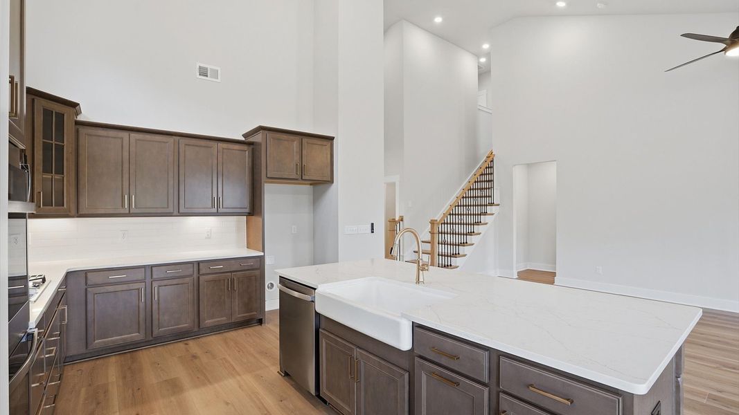 Tasteful kitchen with a streamlined island and modern finishes in a first-class DRB Homes design