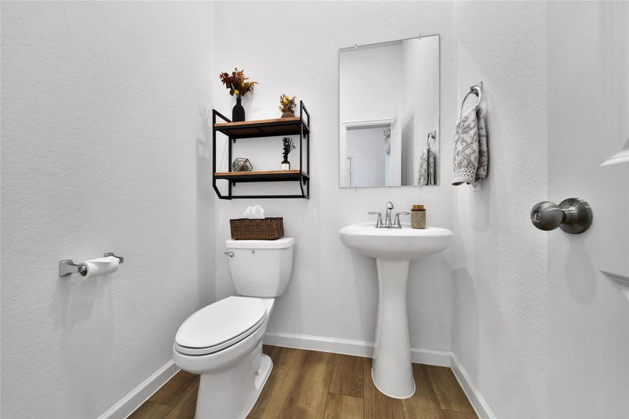 this half bath is just outside the study away from the secondary bedrooms