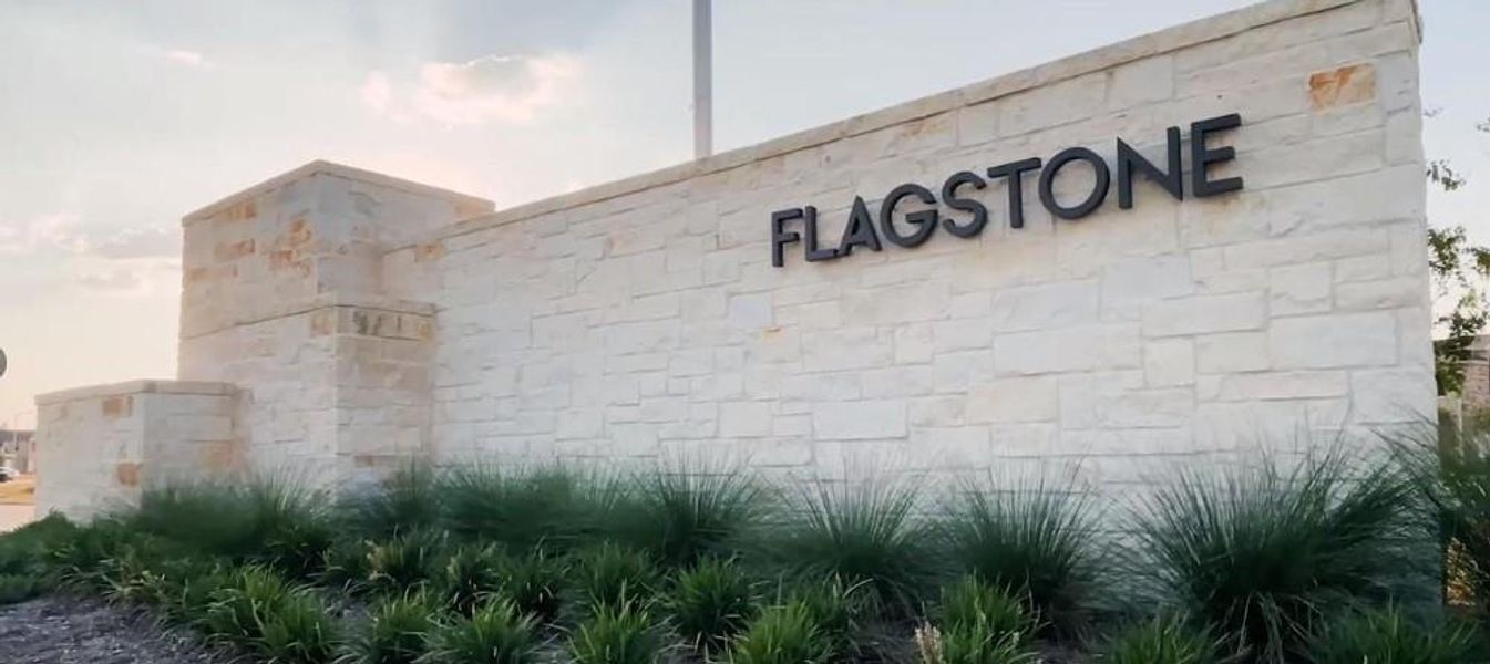 Front exterior of a new home in Flagstone, Humble, TX, highlighting curb appeal (Image 13).