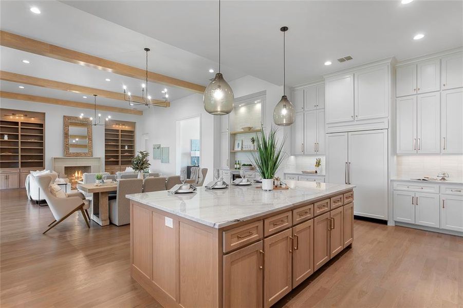 Kitchen and living features a light and bright color palette.