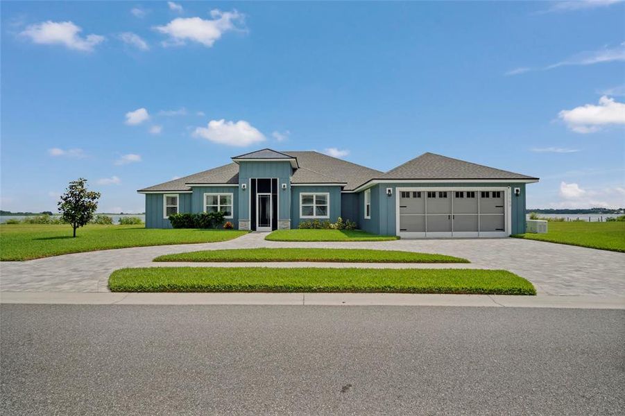 Front exterior of a new home in , Auburndale, FL, highlighting curb appeal (Image 28).