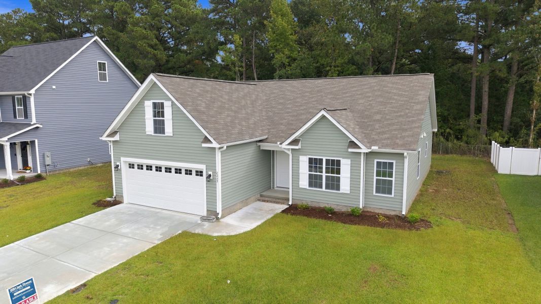 Front exterior of a new home in Davenport Farms, Winterville, NC, highlighting curb appeal (Image 20).