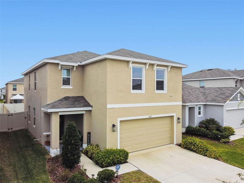 Front exterior of a new home in Westgate at Avalon Park, Wesley Chapel, FL, highlighting curb appeal (Image 32).
